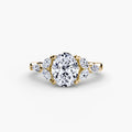 The Shoulder Cluster Ring in yellow gold with an oval centre stone