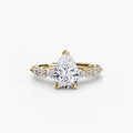 Solitaire with Eternity Pavé engagement ring in yellow gold with a pear-shaped centre stone