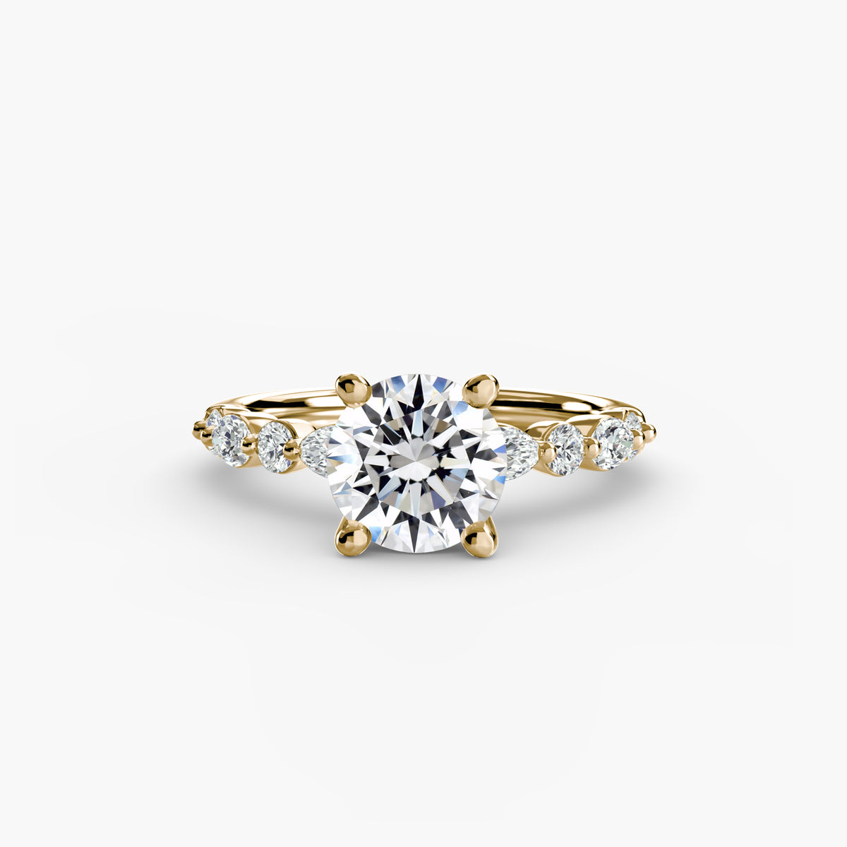 Solitaire with Eternity Pavé engagement ring in yellow gold with a round centre stone