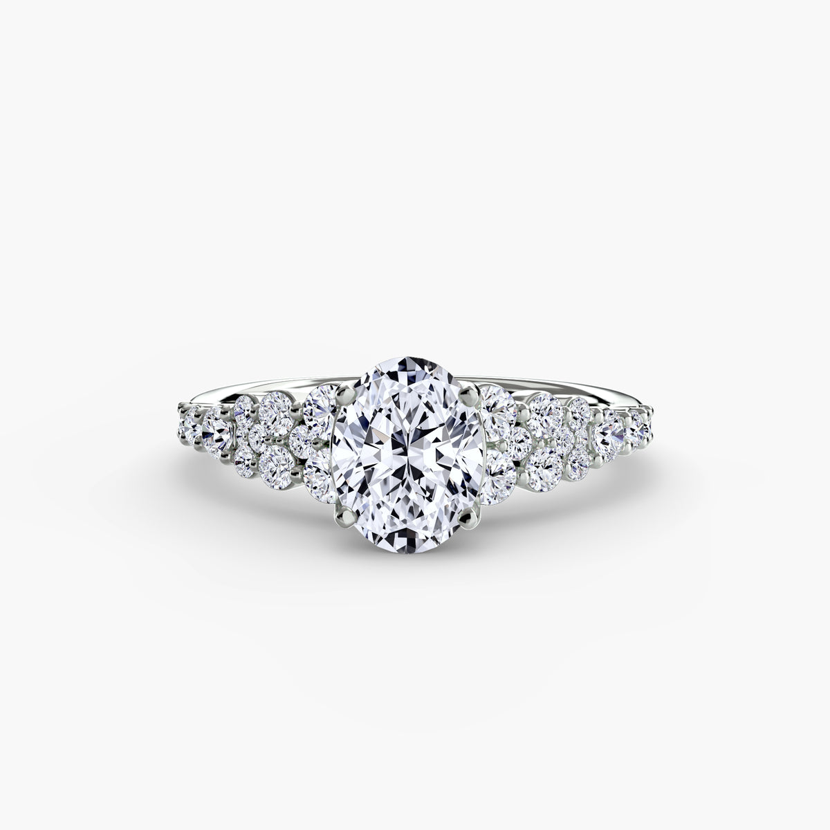The Celestial Cluster Ring in white gold with an oval centre stone