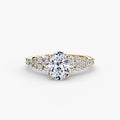 The Celestial Cluster Ring in yellow gold with an oval centre stone