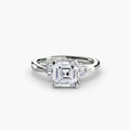 The Celestial Cluster Ring in white gold with an Asscher-cut centre stone