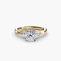 The Celestial Cluster Ring in yellow gold with a cushion-cut centre stone