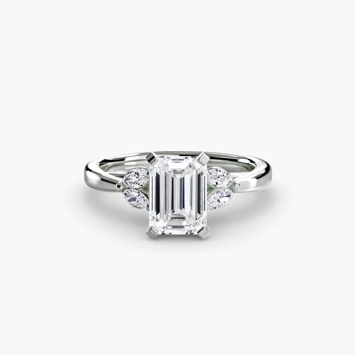 The Celestial Cluster Ring in white gold with an emerald-cut centre stone