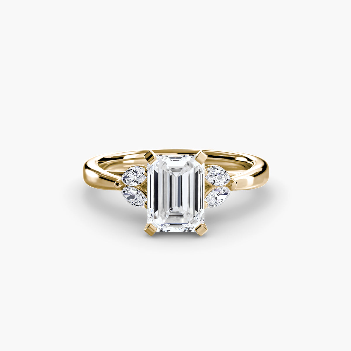 The Celestial Cluster Ring in yellow gold with an emerald-cut centre stone