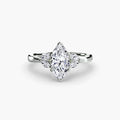 The Celestial Cluster Ring in white gold with a marquise centre stone