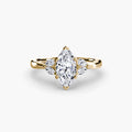 The Celestial Cluster Ring in yellow gold with a marquise centre stone
