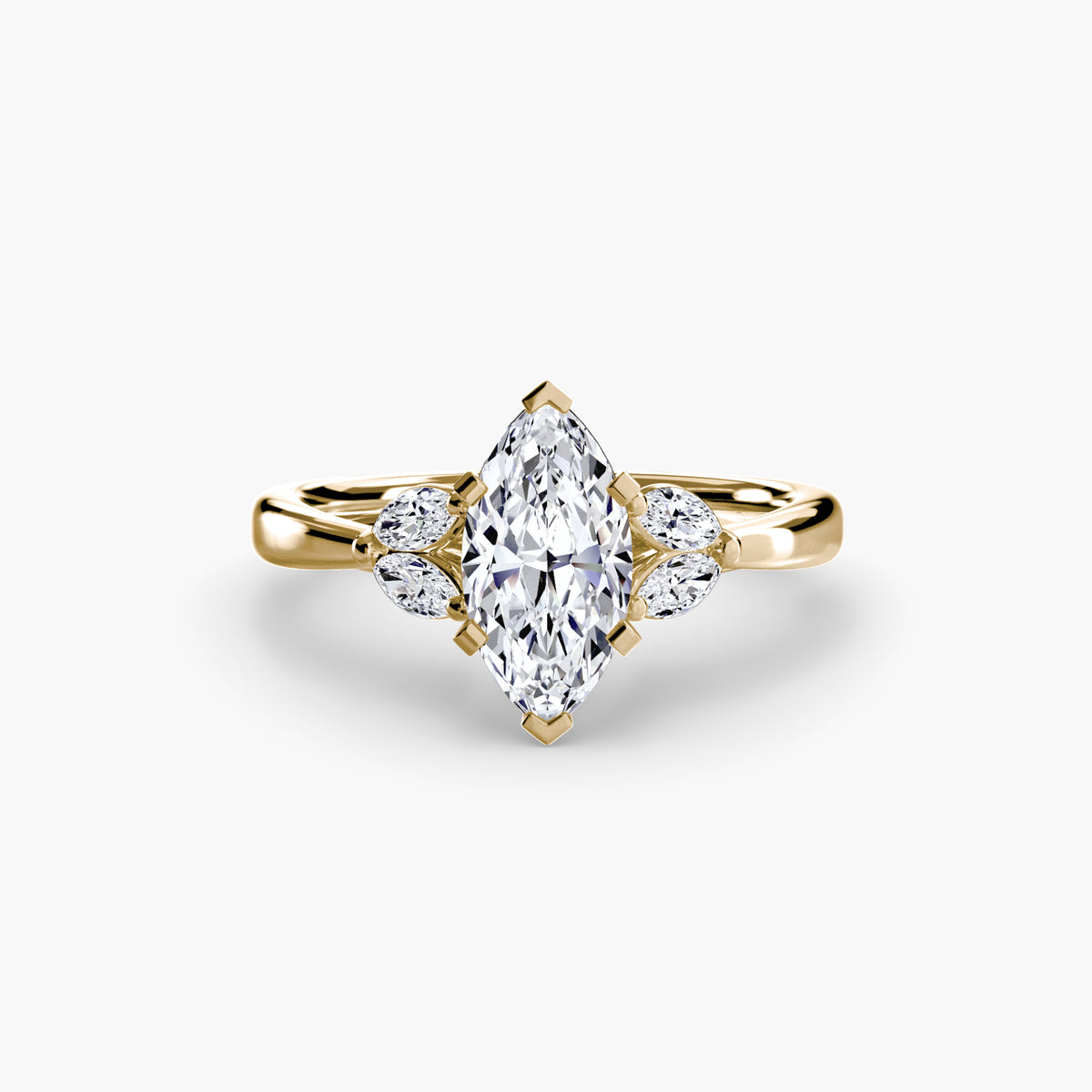 The Celestial Cluster Ring in yellow gold with a marquise centre stone