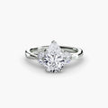 The Celestial Cluster Ring in white gold with a pear-shaped centre stone