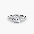 The Celestial Cluster Ring in white gold with a radiant-cut centre stone