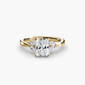 The Celestial Cluster Ring in yellow gold with a radiant-cut centre stone