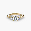 The Celestial Cluster Ring in yellow gold with a round centre stone