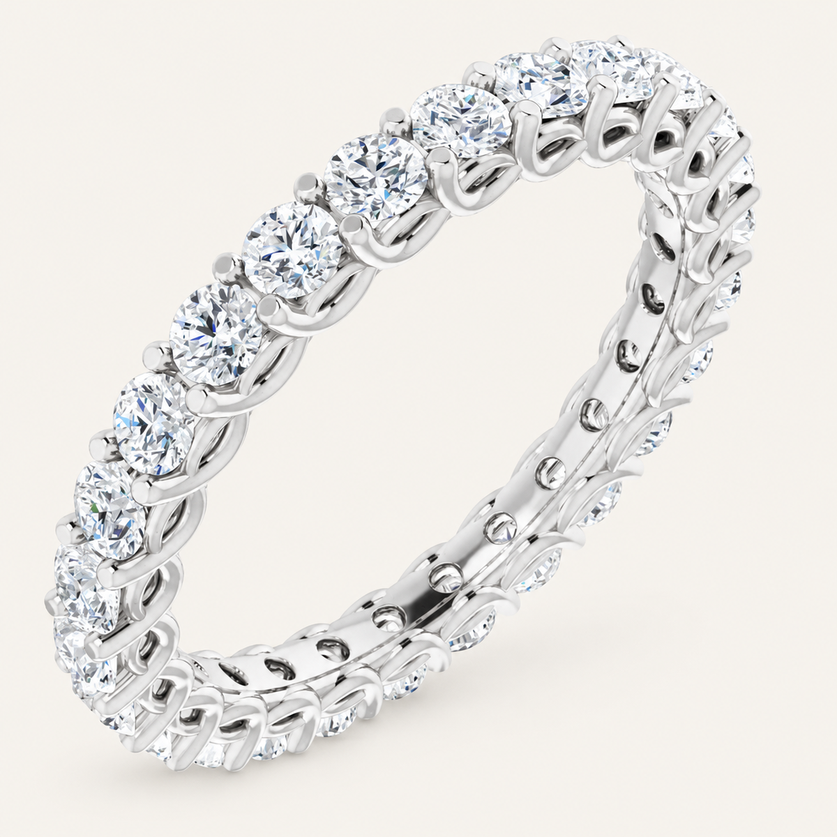 Natural diamond full eternity ring with interlocking design in white metal on an ivory background