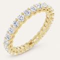 Natural diamond full eternity ring with interlocking design in yellow gold on an ivory background