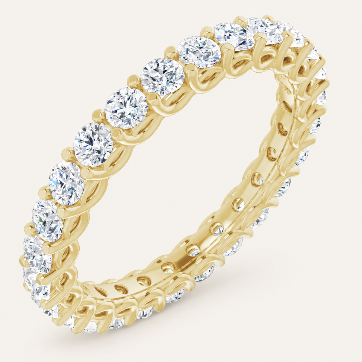 Natural diamond full eternity ring with interlocking design in yellow gold on an ivory background