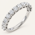 Lab-grown diamond half eternity ring in white metal on an ivory background