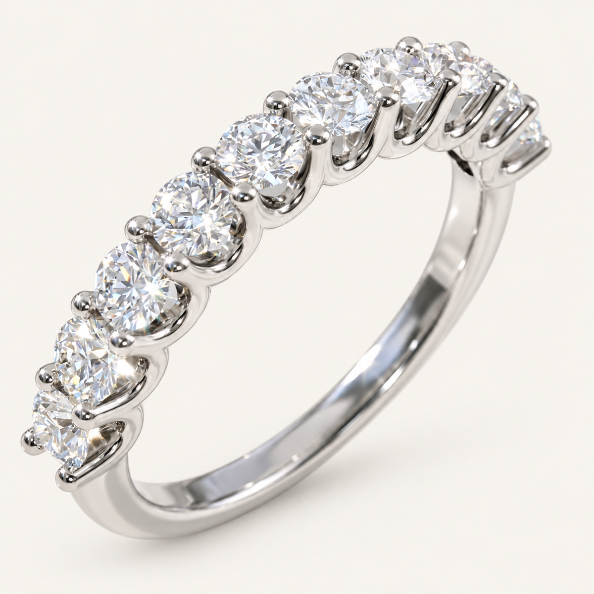1ct diamond Ubar style half eternity ring in white metal on an ivory background