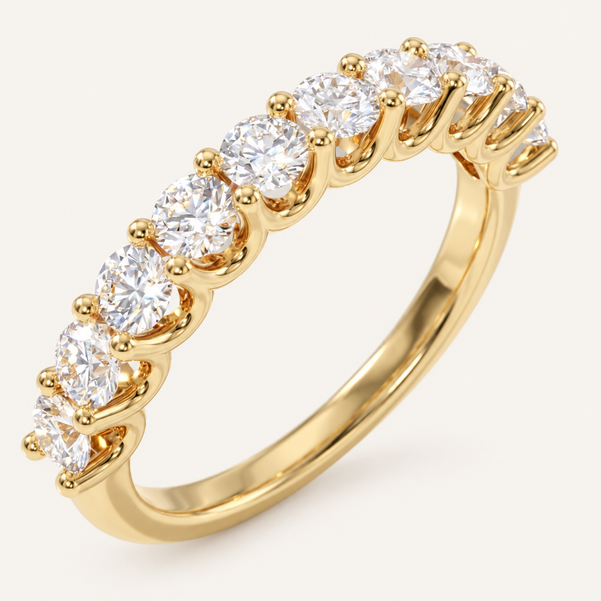 1ct diamond Ubar style half eternity ring in yellow gold on an ivory background