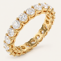2ct Lab Diamond Full Eternity Ring in yellow gold on an ivory background