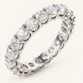 2ct natural diamond full eternity ring in white metal on an ivory background