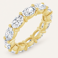 4ct oval diamond full eternity ring in yellow gold on an ivory background