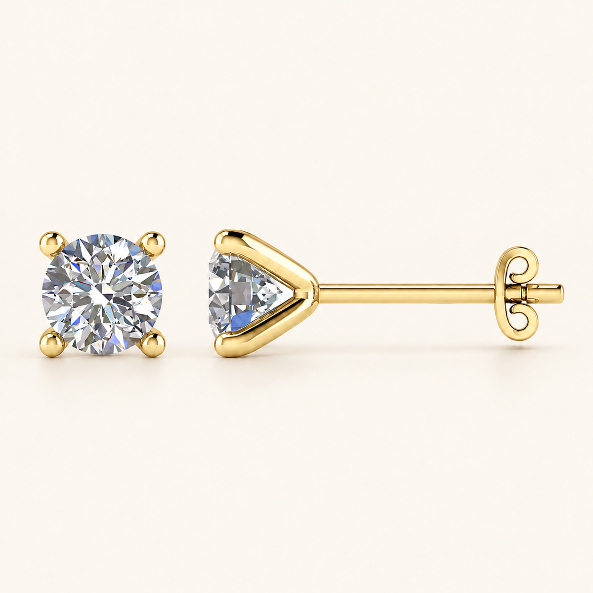 Yellow gold four-claw martini diamond studs with open tapered setting and no gallery rail