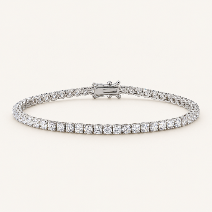 Diamond tennis bracelet in white gold on an ivory background