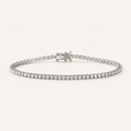 Diamond tennis bracelet in white gold on an ivory background