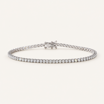 Diamond tennis bracelet in white gold on an ivory background