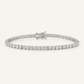 Diamond tennis bracelet in white gold on an ivory background