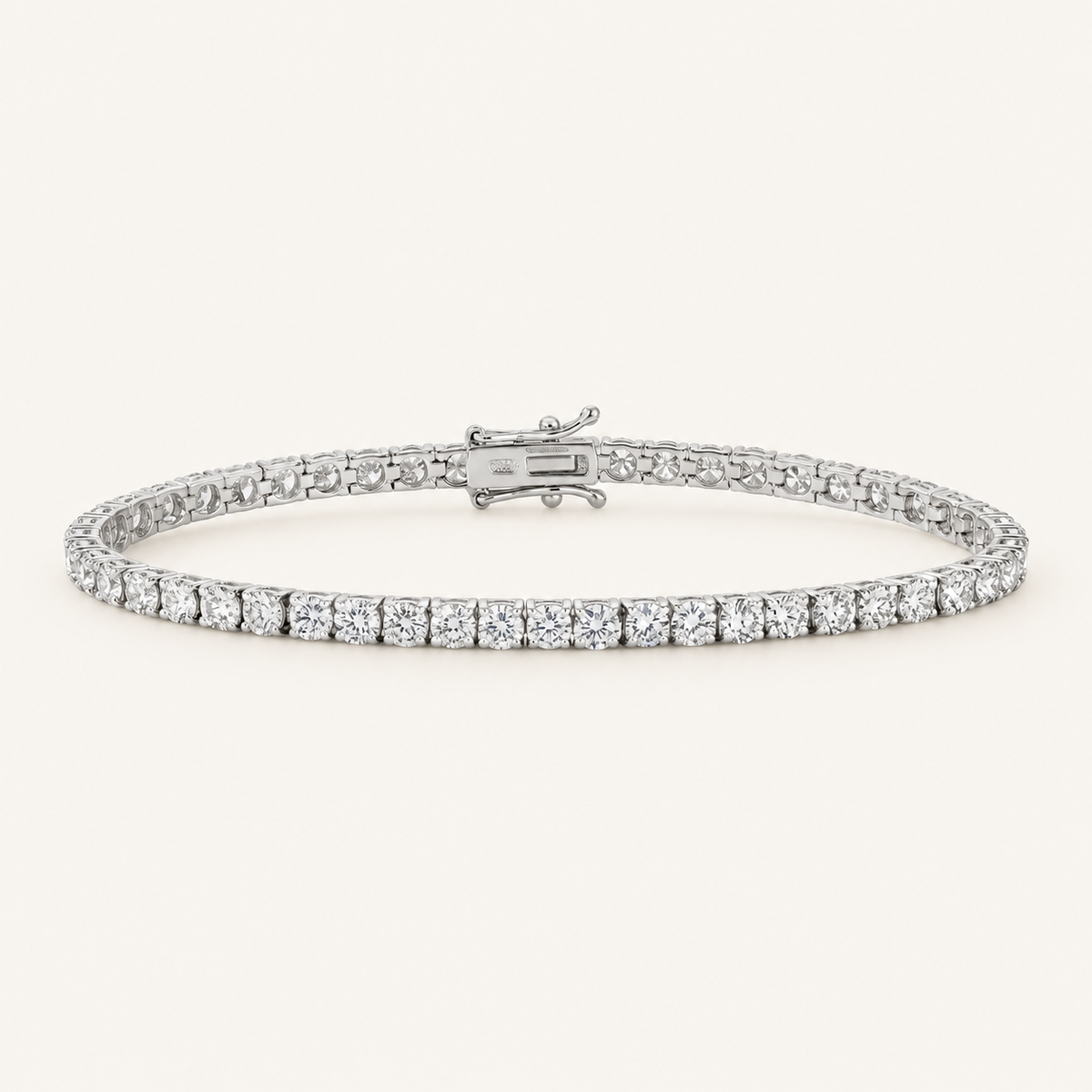 Diamond tennis bracelet in white gold on an ivory background