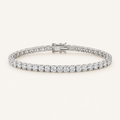 Diamond tennis bracelet in white gold on an ivory background