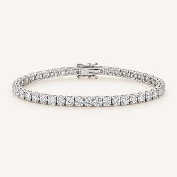 Diamond tennis bracelet in white gold on an ivory background