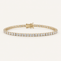 Diamond tennis bracelet in yellow gold on an ivory background