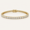 Diamond tennis bracelet in yellow gold on an ivory background