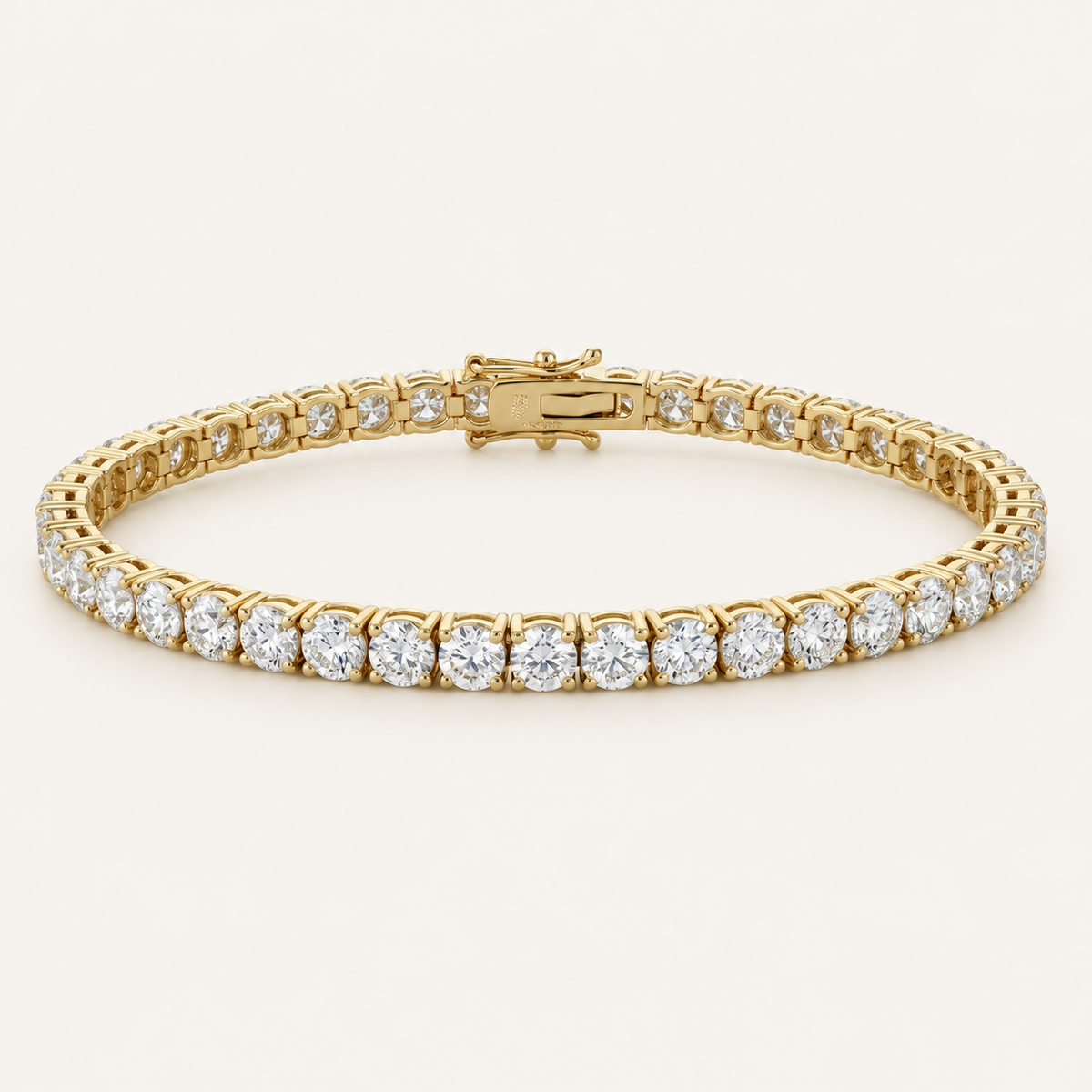 Diamond tennis bracelet in yellow gold on an ivory background